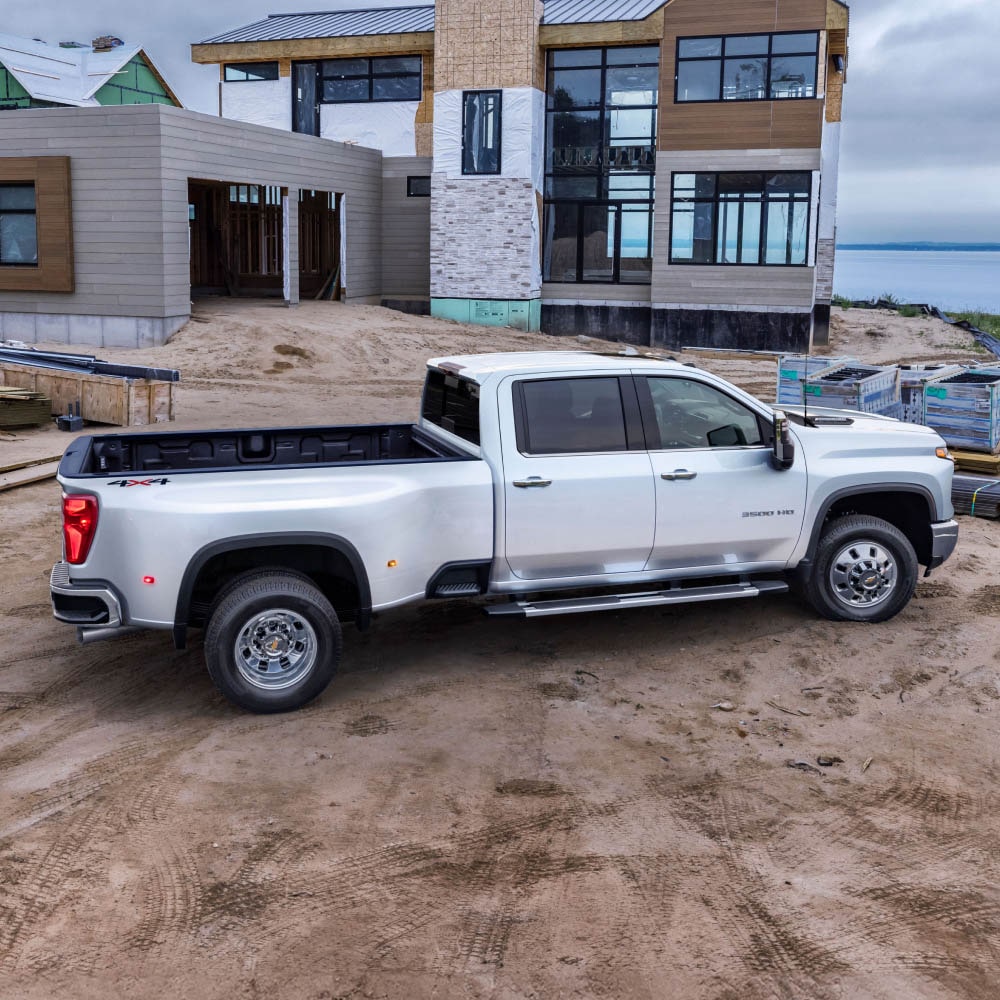 Side View of the 2026 Chevrolet Silverado HD Work Truck parked on a Job Site.