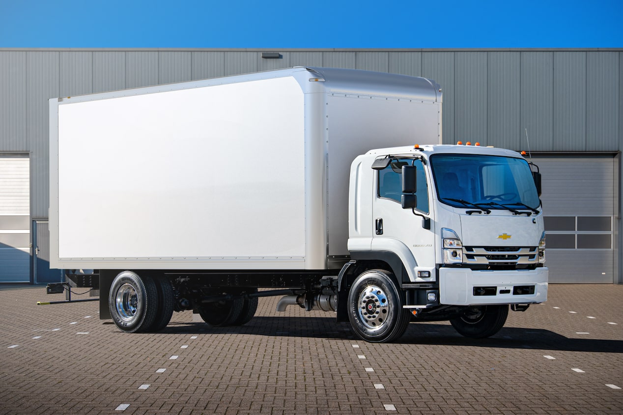 A Chevrolet commercial truck parked at a parking lot on a sunny day.