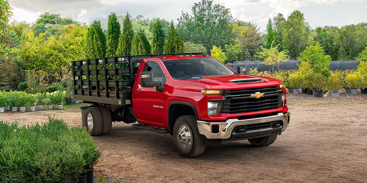 A Chevrolet commercial Chassis Cab parked at job site.