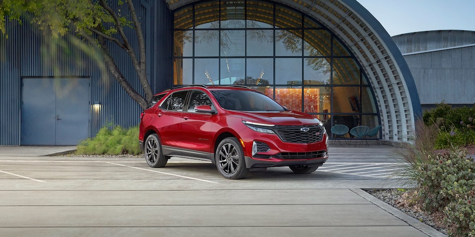 The stylish & versatile 2024 Chevrolet Equinox parked outside the office